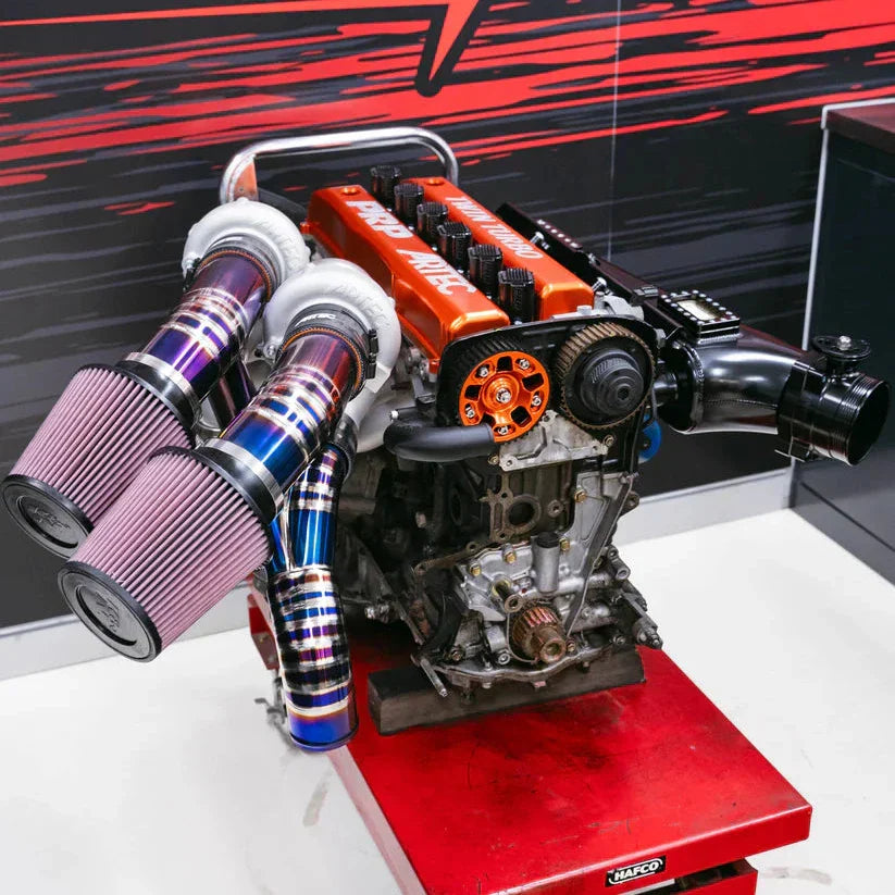 Twin Turbo Kit for Toyota 2JZ-GTE with 4-cylinder engine, purple intake, blue exhaust