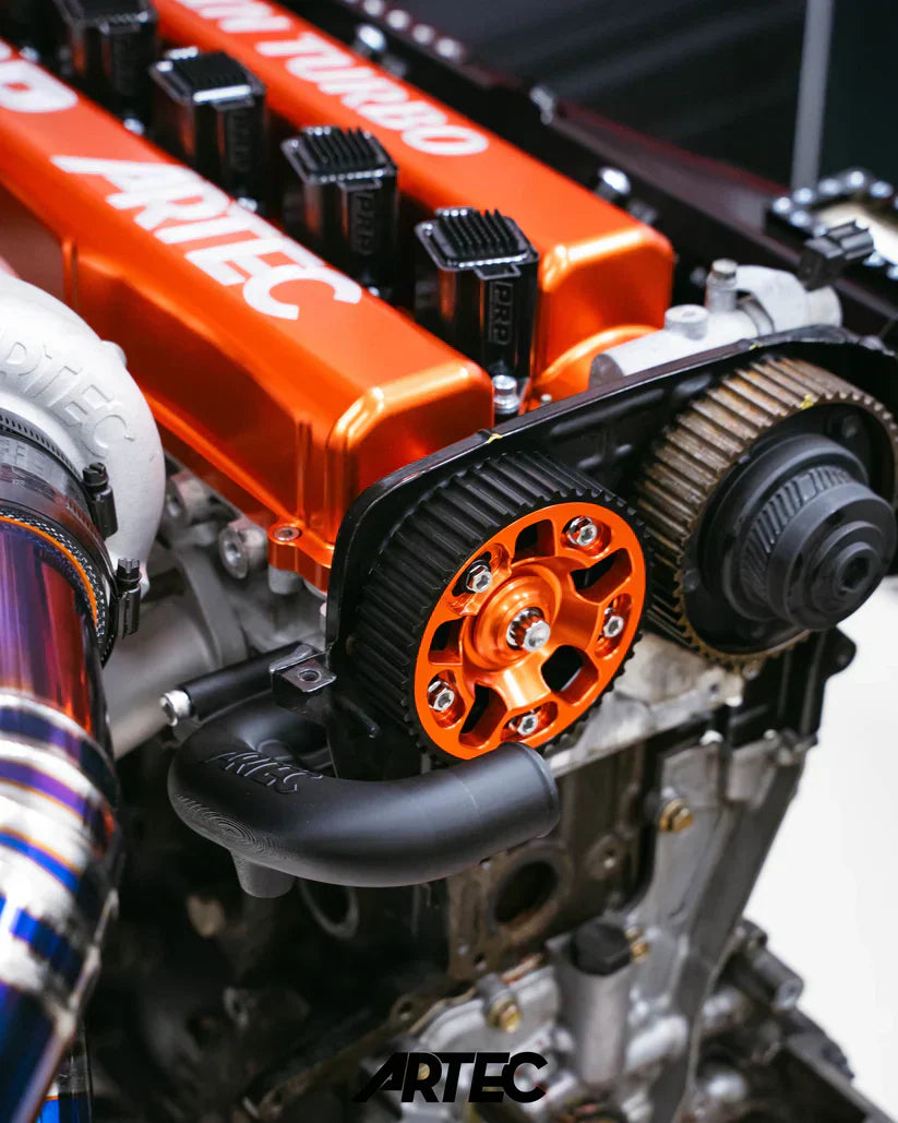 Orange Artec engine with black and silver components in Twin Turbo Kit for Toyota 2JZ-GTE pre-release