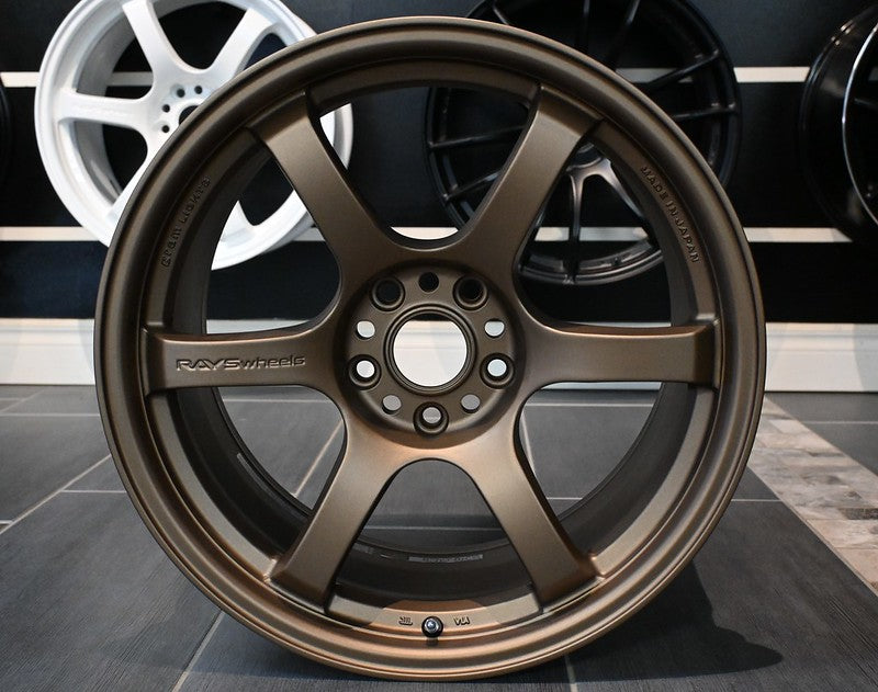 Bronze Rays Gram Lights 57DR forged alloy wheel with multi-spoke design and center cap