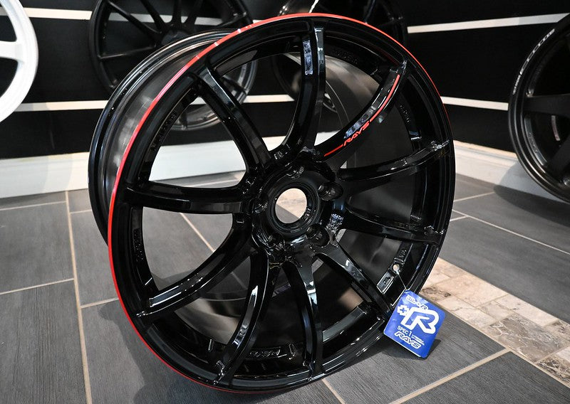 Glossy black and red RAYS Gram Lights 57Transcend Rev Limit multi-spoke alloy wheel