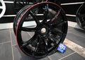 Glossy black and red RAYS Gram Lights 57Transcend Rev Limit multi-spoke alloy wheel