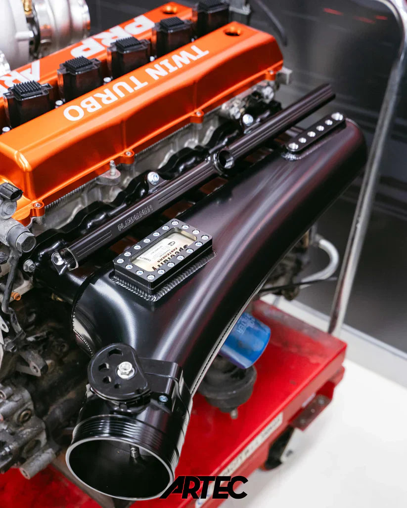 Twin turbo engine block with orange black accents Artec branding