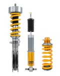 Yellow and silver Ohlins adjustable coilover suspension kit for track use